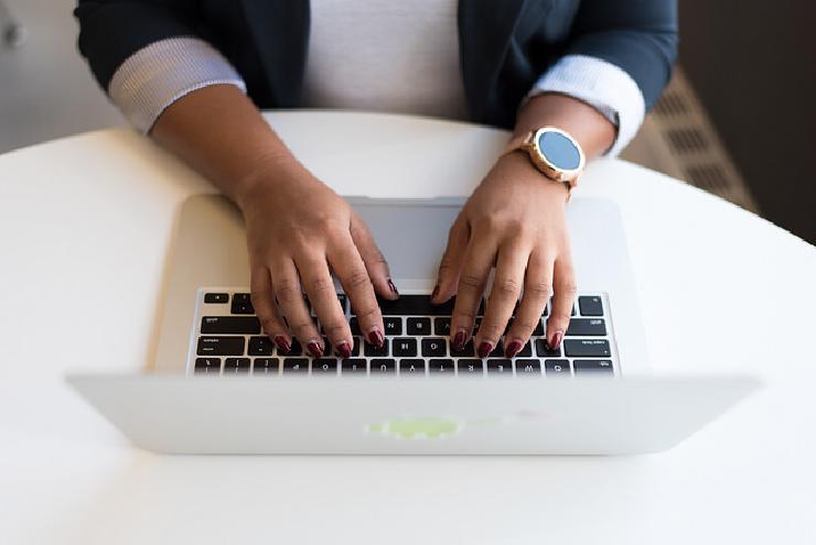 Photo of hands on a keyboard