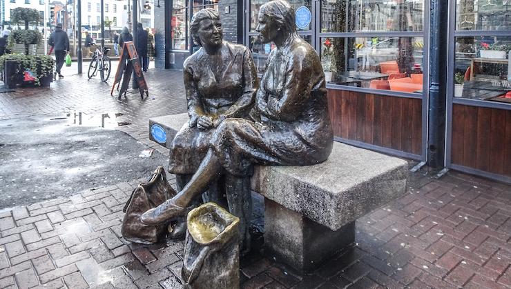 photo of statues talking